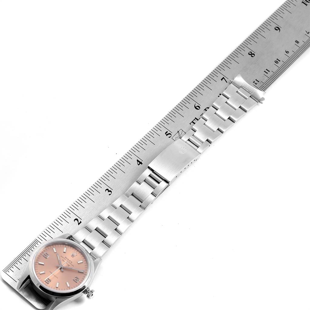 The image shows a Rolex Air-King 14000 Stainless Steel Pink Dial 14000 Stainless Steel Pink Dial watch laid flat with a ruler next to it, highlighting the band and clasp.