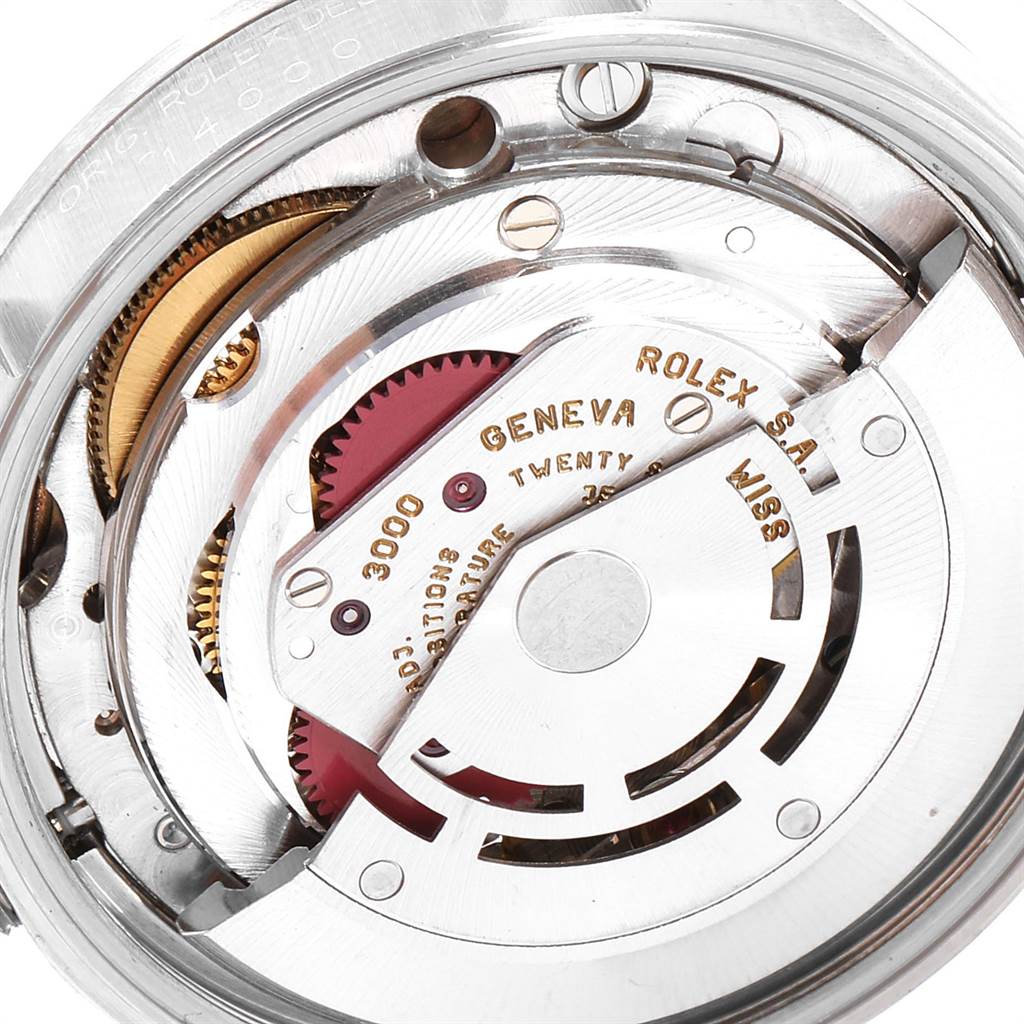 This image shows a close-up of the Rolex Air-King 14000 Stainless Steel Pink Dial 14000 Stainless Steel Pink Dial watch's movement mechanism, highlighting its intricate components and engravings.