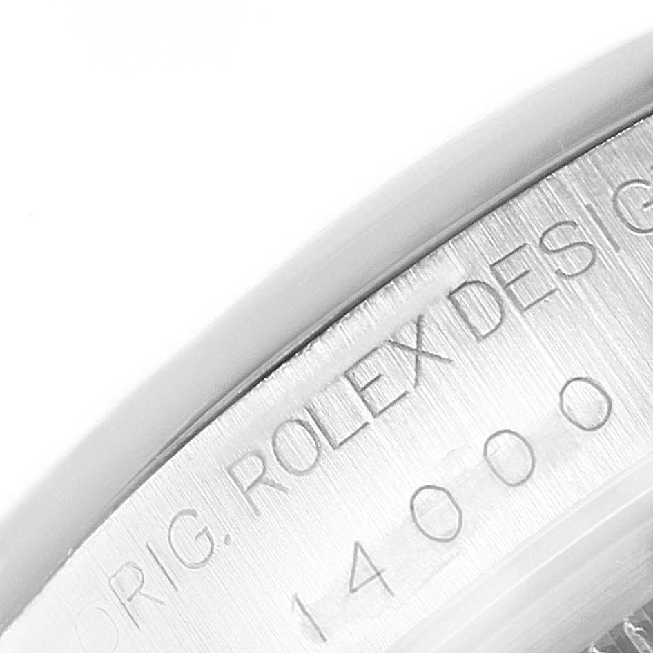 This image shows a close-up of the serial number and "ROLEX" engraving on the case back of a Rolex Air-King 14000 Stainless Steel Pink Dial 14000 Stainless Steel Pink Dial watch.
