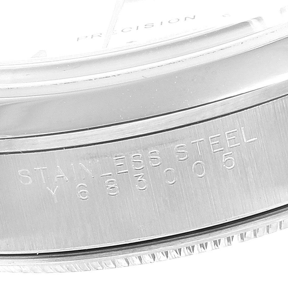 This image shows a close-up of the side of a Rolex Air-King 14000 Men's Stainless Steel Silver Dial 14000 Men's Stainless Steel Silver Dial model watch, highlighting the "Stainless Steel" engraving.