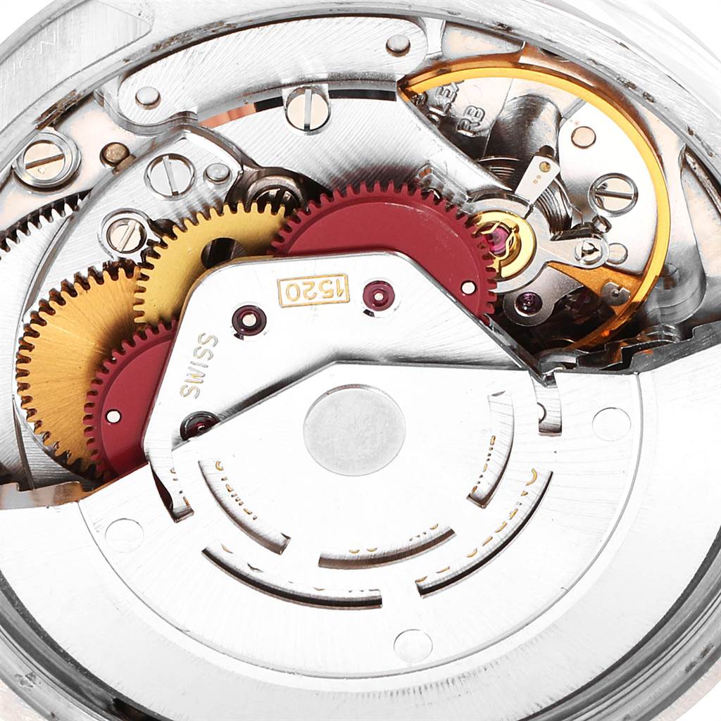 The image shows a close-up view of the internal mechanism of a Rolex Air-King 5500 Men's Stainless Steel Silver Dial 5500 Men's Stainless Steel Silver Dial watch, highlighting gears and components.