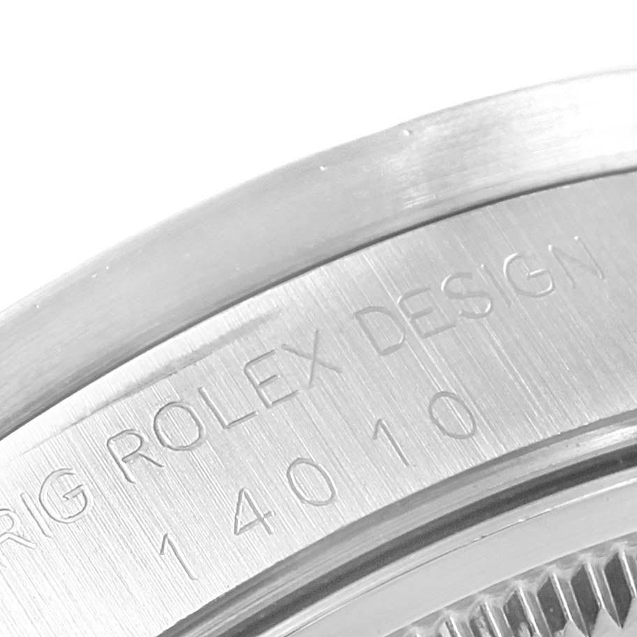 This close-up image shows the engraved details on the back of the bezel of a Rolex Air-King 14010 Men's Stainless Steel White Dial 14010 Men's Stainless Steel White Dial watch.