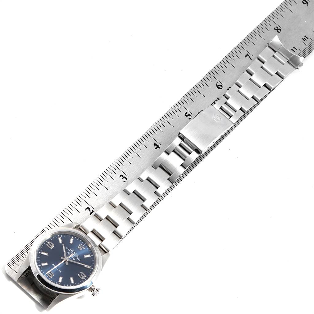 The image shows a Rolex Air-King 14000 Men's Stainless Steel Blue Dial 14000 Men's Stainless Steel Blue Dial watch lying flat with its band extended next to a ruler for measuring.