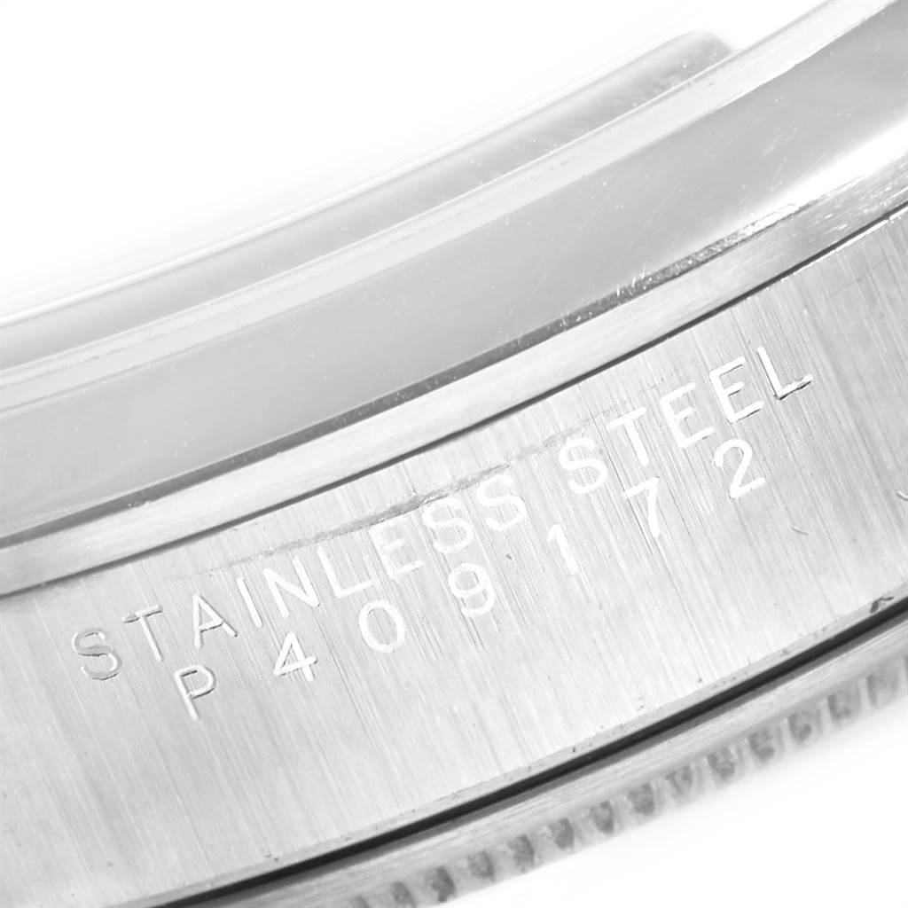 The image shows a close-up of the stainless steel case back with engravings on the Rolex Air-King 14000 Men's Stainless Steel Blue Dial 14000 Men's Stainless Steel Blue Dial model watch.