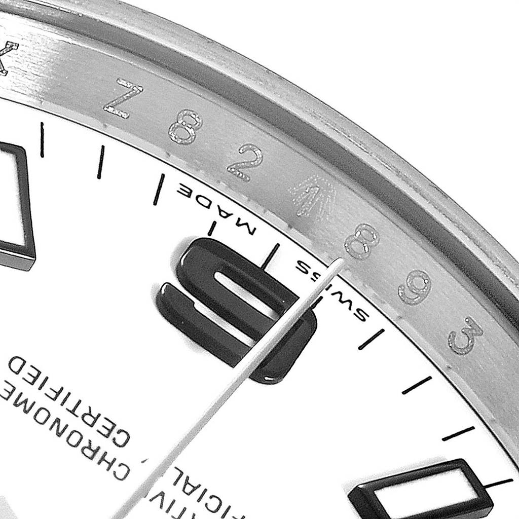 The image shows a close-up of the dial and bezel of a Rolex Air-King 114200 Men's Stainless Steel White Dial 114200 Men's Stainless Steel White Dial watch, highlighting the numbers and part of the logo.
