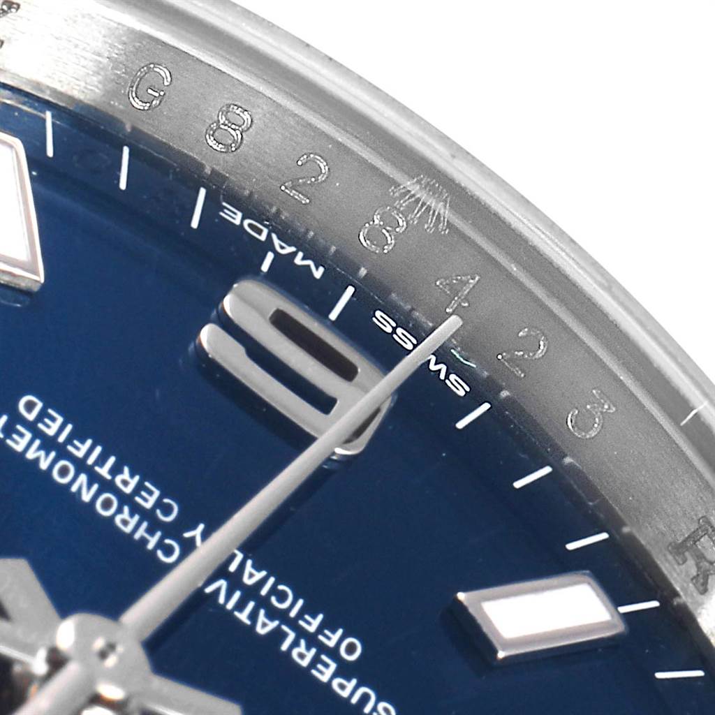 This close-up image shows the dial and part of the bezel of the Rolex Air-King 114200 Men's Stainless Steel Blue Dial 114200 Men's Stainless Steel Blue Dial watch, focusing on the hour markers and second hand.