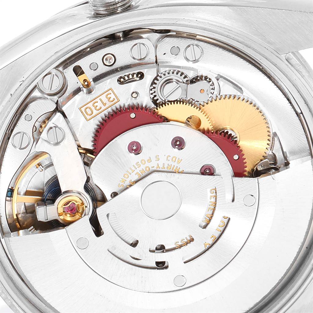 This image shows a close-up view of the internal mechanism of a Rolex Air-King 114200 Men's Stainless Steel Blue Dial 114200 Men's Stainless Steel Blue Dial watch, focusing on the gears and movement components.