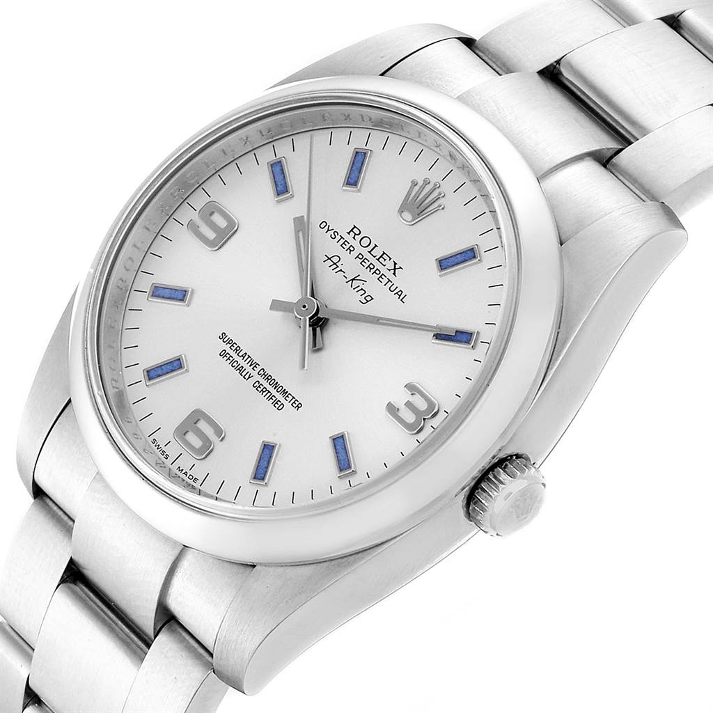 The Rolex Air-King 114200 Men's Stainless Steel Silver Dial 114200 Men's Stainless Steel Silver Dial watch is shown from an angled, close-up view revealing its face, dial, and part of the bracelet.
