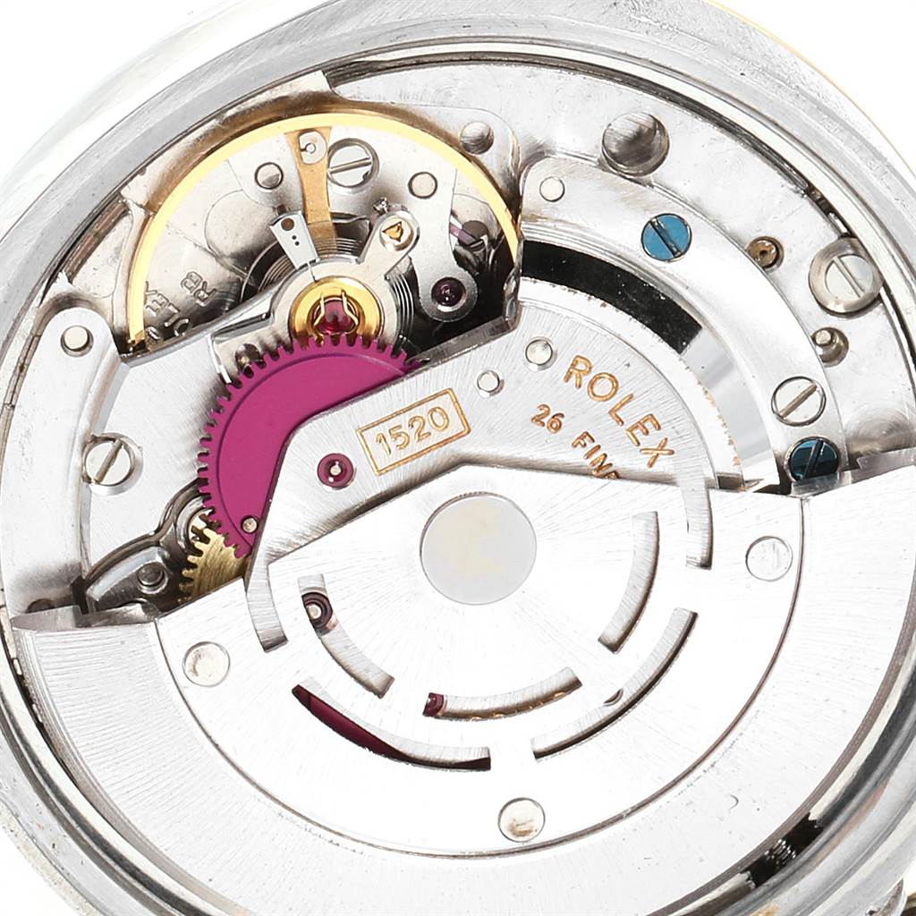 This is a close-up view of the internal mechanism of a Rolex Vintage Collection 5701 Men's Steel and Gold (two tone) Silver Dial 5701 Men's Steel and Gold (two tone) Silver Dial model, showcasing the automatic movement and various gears.