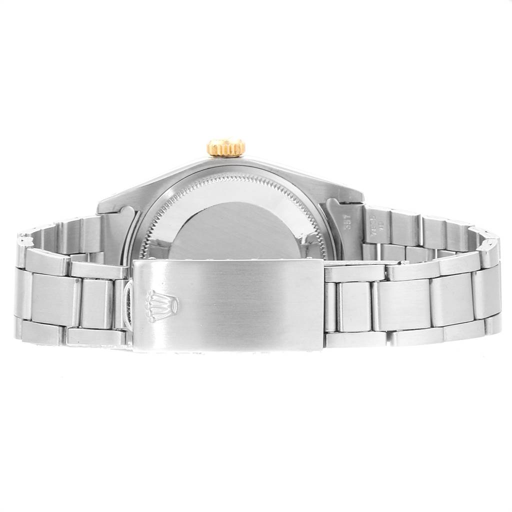 This is a rear view of the Rolex Vintage Collection 5701 Men's Steel and Gold (two tone) Silver Dial 5701 Men's Steel and Gold (two tone) Silver Dial model watch, showing its metal bracelet and closed clasp.