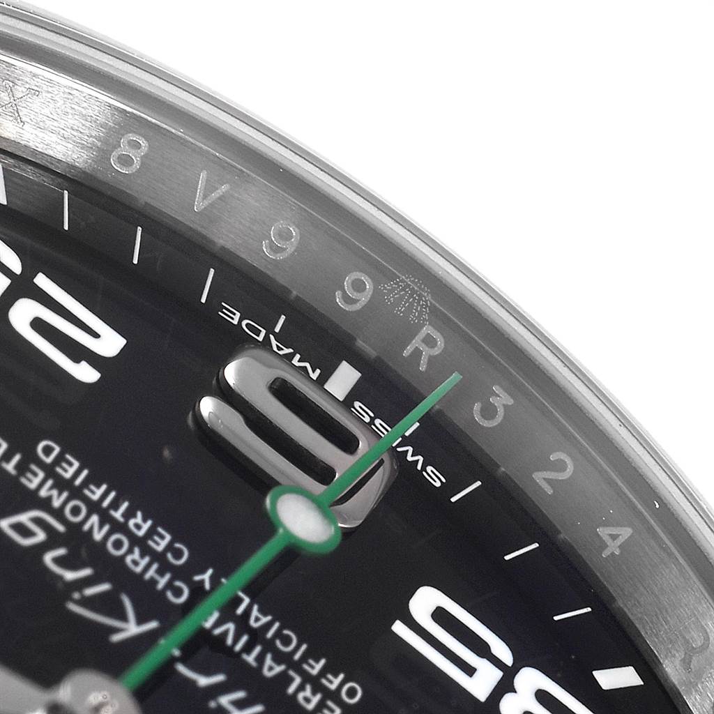 The image shows a close-up of the Rolex Air-King 116900 Men's Stainless Steel Black Dial 116900 Men's Stainless Steel Black Dial watch dial, highlighting the 9 and 3 o'clock markers and the green second hand.