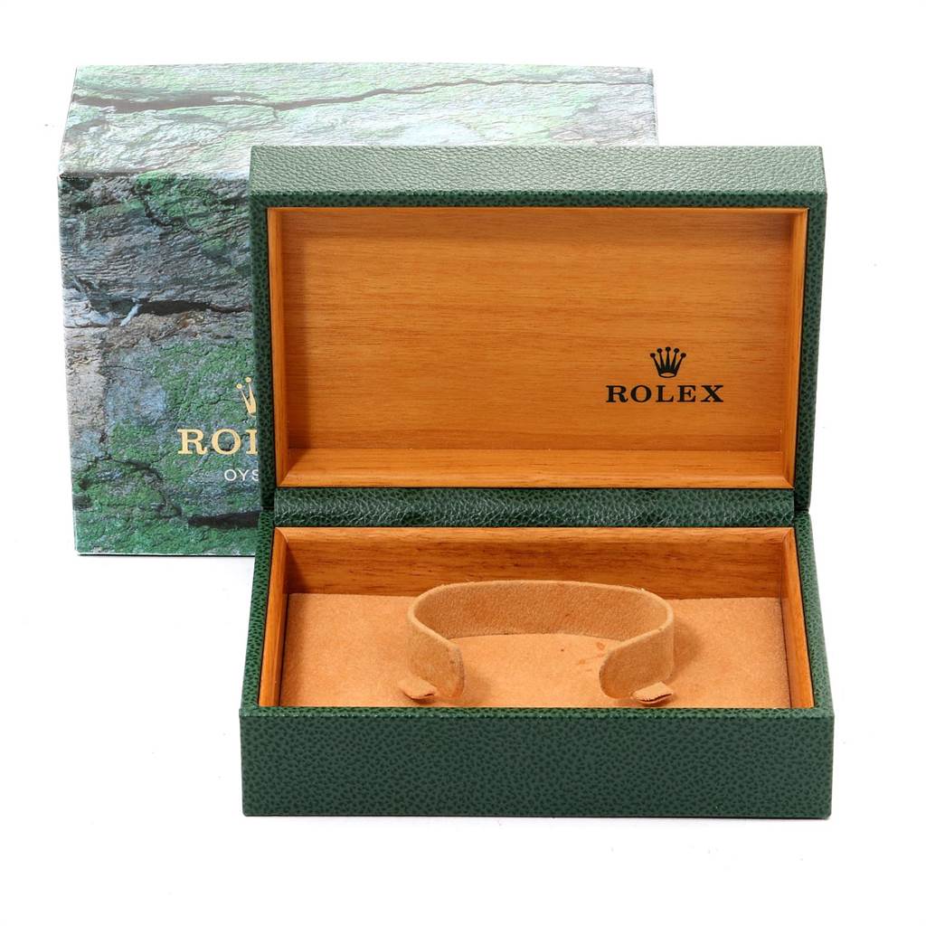 This image shows an open green Rolex Air-King 14000 Men's Stainless Steel Black Dial 14000 Men's Stainless Steel Black Dial watch box and its inner cushioned holder.