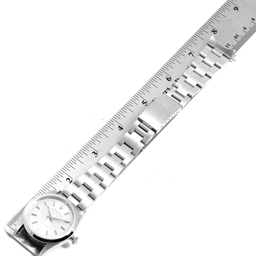 The image shows a top view of a Rolex Air-King 14000 Men's Stainless Steel Silver Dial 14000 Men's Stainless Steel Silver Dial watch, focusing on the face and bracelet laid against a ruler.