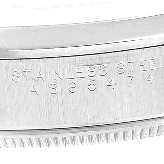 The image shows a partial view of the case back of a Rolex Air-King 14000 Men's Stainless Steel Silver Dial 14000 Men's Stainless Steel Silver Dial watch, highlighting the engraved serial number and "STAINLESS STEEL" text.