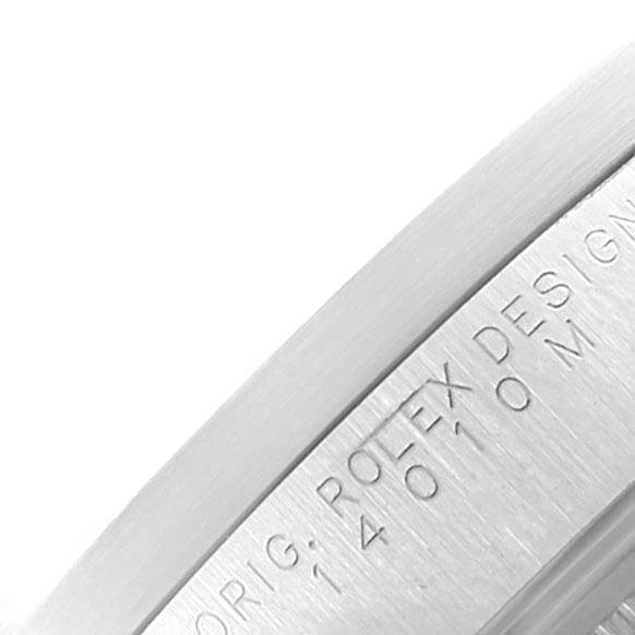 This image shows a close-up of the bezel on a Rolex Air-King 14010 Men's Stainless Steel Blue Dial 14010 Men's Stainless Steel Blue Dial watch, displaying engraved text.