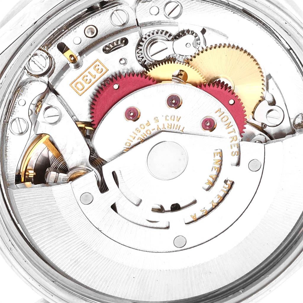 This image shows the intricate inner mechanism of the Rolex Air-King 14010 Men's Stainless Steel Blue Dial 14010 Men's Stainless Steel Blue Dial watch, highlighting its gears and components.