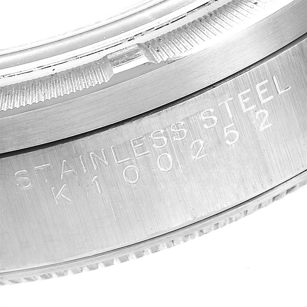 This is a close-up view of the side of the case back of a Rolex Air-King 14010 Men's Stainless Steel Blue Dial 14010 Men's Stainless Steel Blue Dial watch, showing the stainless steel engraving.