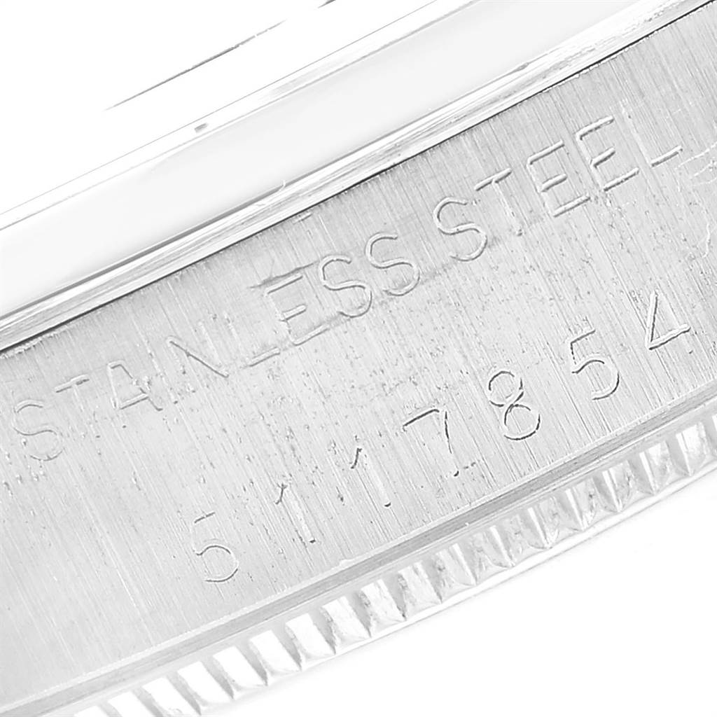 This image shows a close-up angle of the engraved serial number and "stainless steel" text on the bezel of a Rolex Air-King 5500 Men's Stainless Steel Silver Dial 5500 Men's Stainless Steel Silver Dial watch.