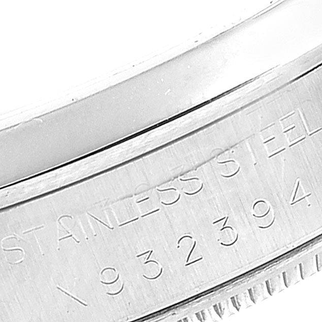 This close-up image shows the side of the stainless steel bezel and case with engraving on the Rolex Air-King 14000 Men's Stainless Steel Pink Dial 14000 Men's Stainless Steel Pink Dial model.