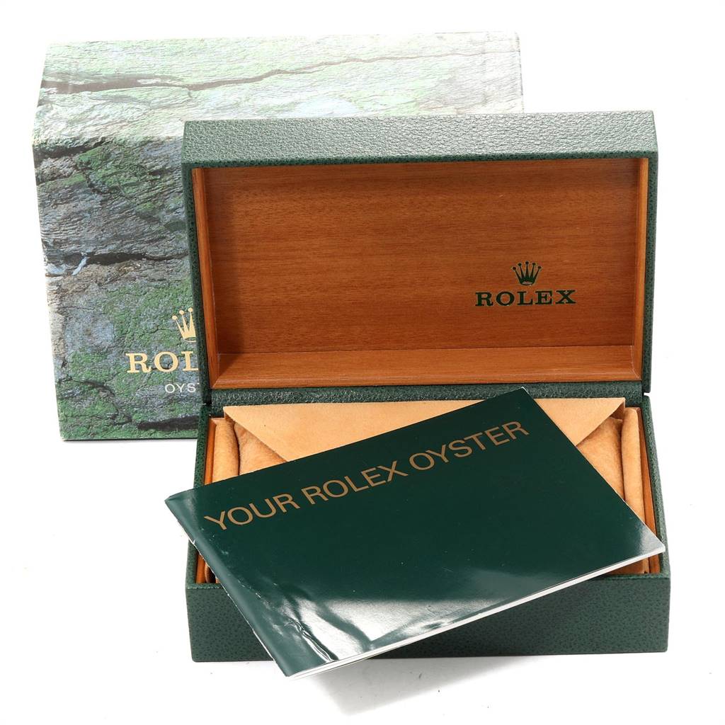 The image shows an open Rolex Air-King 14000 Men's Stainless Steel Pink Dial 14000 Men's Stainless Steel Pink Dial watch box with a booklet and a soft pouch inside.