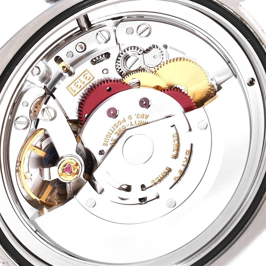 The image shows a close-up of the internal mechanism of a Rolex Air-King 116900 Men's Stainless Steel Black Dial 116900 Men's Stainless Steel Black Dial watch, highlighting its gears and components.