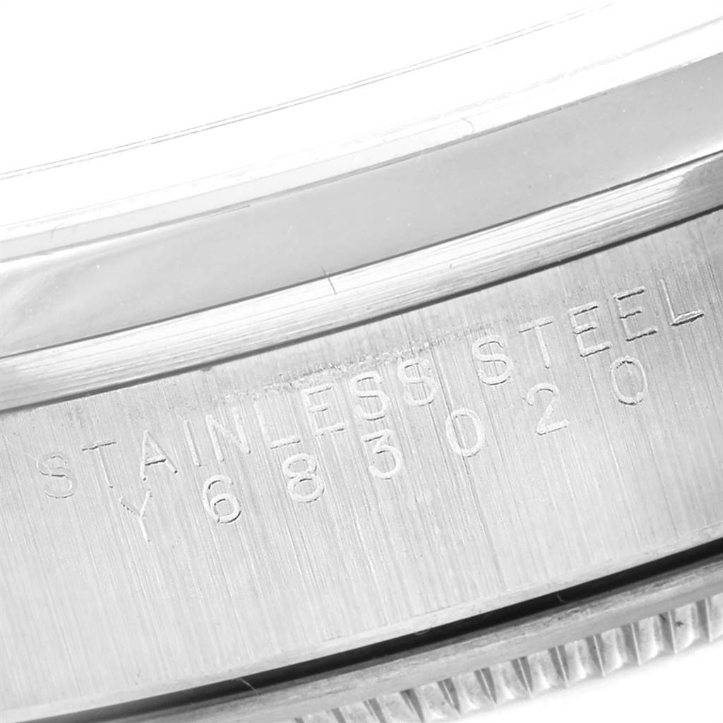 The image shows a close-up of the serial number engraving on the stainless steel case of a Rolex Air-King 14000 Men's Stainless Steel Silver Dial 14000 Men's Stainless Steel Silver Dial watch.