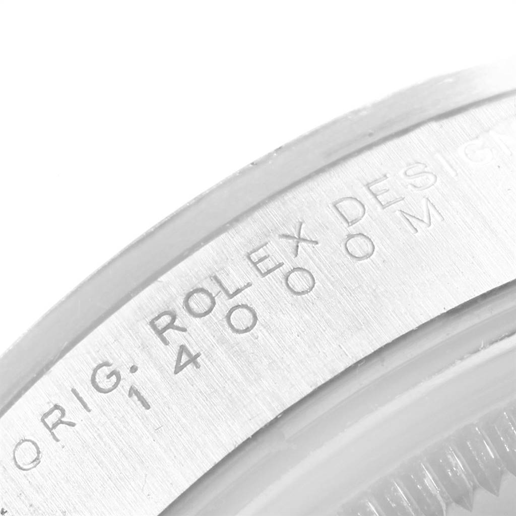 The image shows a close-up of the Rolex Air-King 14000 Men's Stainless Steel Silver Dial 14000 Men's Stainless Steel Silver Dial's case edge, highlighting its engraved model number "14000M".