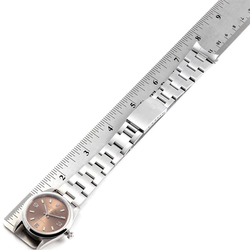 The image shows a Rolex Air-King 14000 Men's Stainless Steel Pink Dial 14000 Men's Stainless Steel Pink Dial watch laid flat with its bracelet fully extended alongside a ruler.