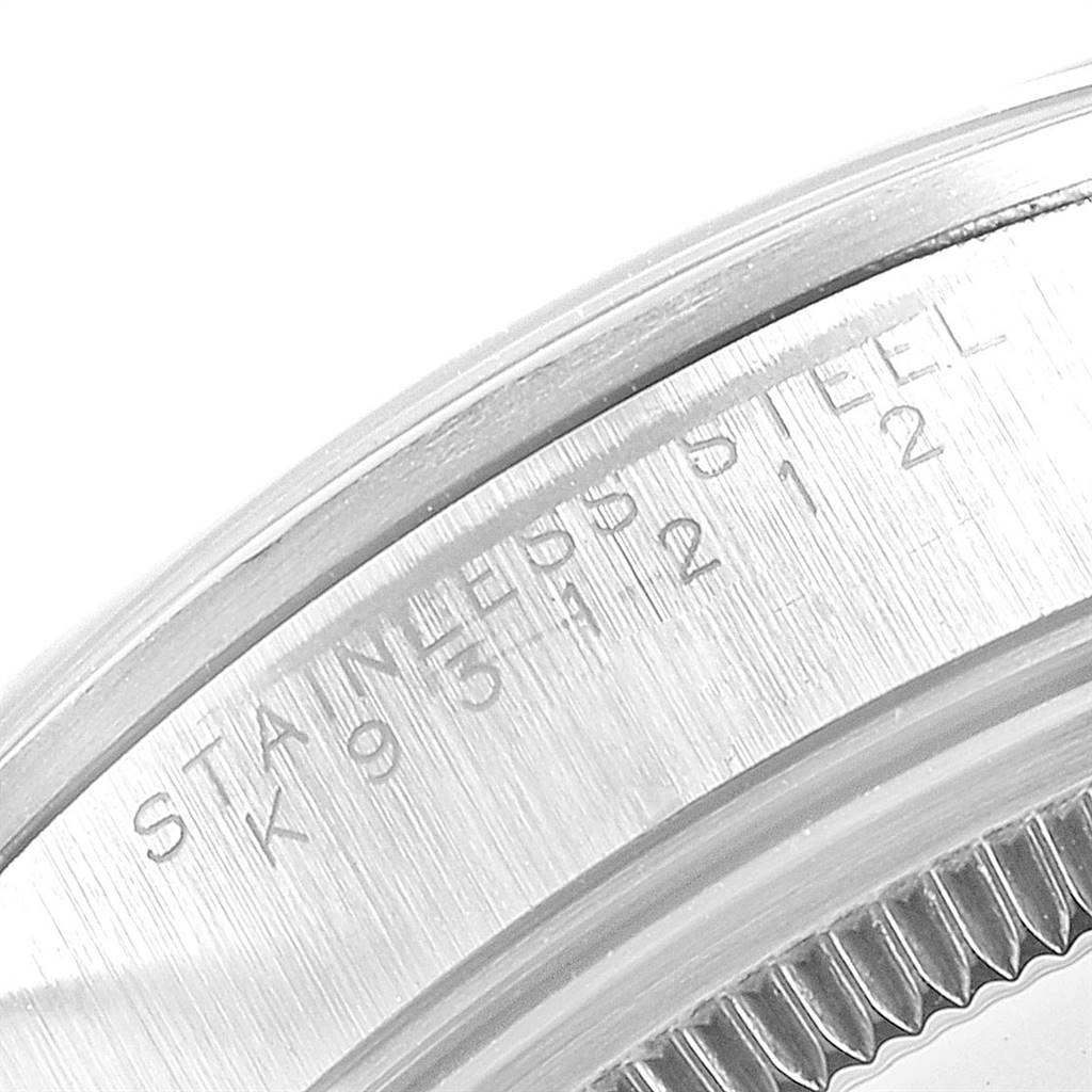 This image shows a close-up of the side of the case of a Rolex Air-King 14000 Men's Stainless Steel Pink Dial 14000 Men's Stainless Steel Pink Dial watch, highlighting the engraving and stainless steel details.