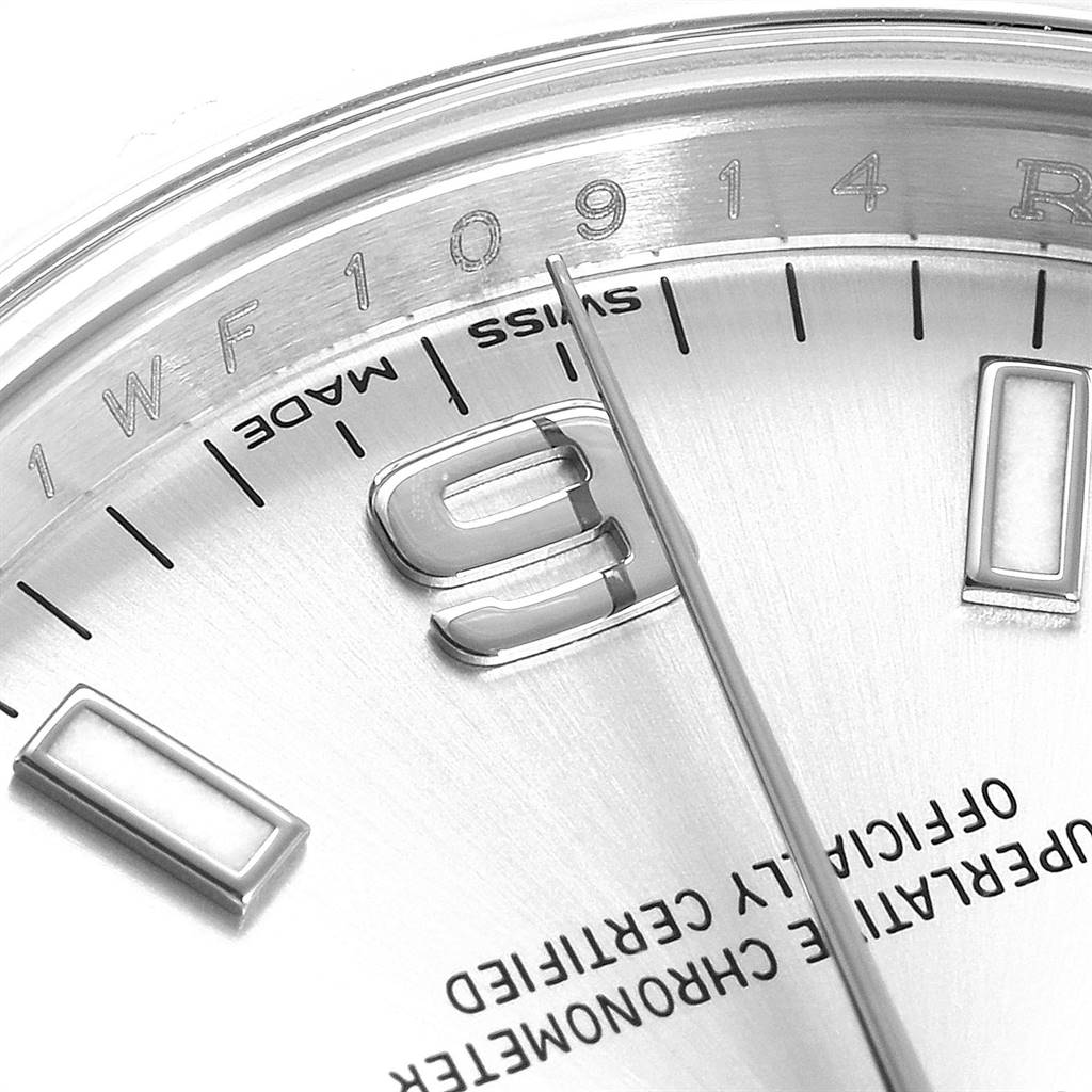 The image shows a close-up of the dial and the hour marker of the Rolex Oyster Perpetual 114200 Men's Stainless Steel Silver Dial 114200 Men's Stainless Steel Silver Dial watch.