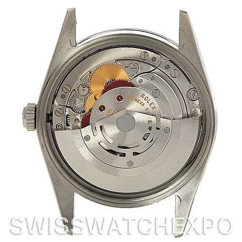 The image features the internal movement of the Rolex Air-King 14000M Men's Stainless Steel Silver Dial 14000M Men's Stainless Steel Silver Dial watch viewed from the back with the case open.