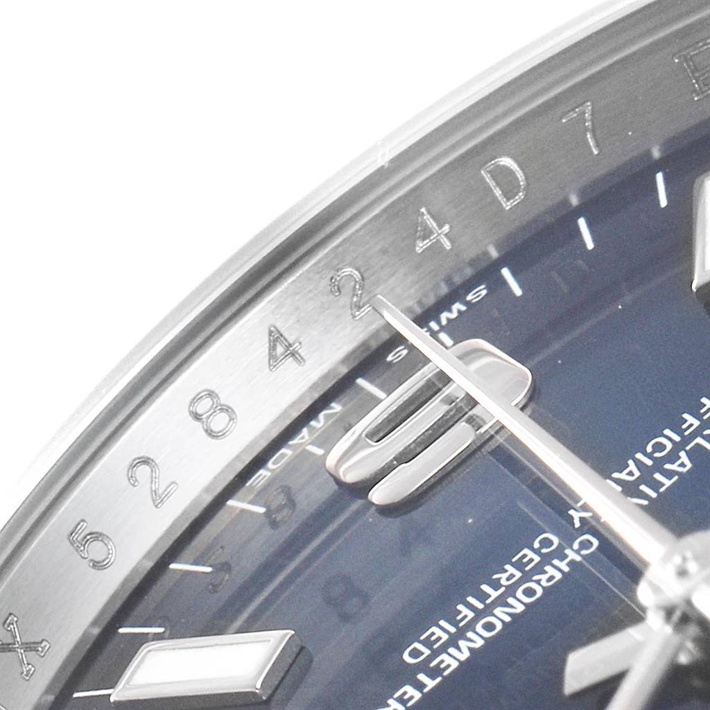 This close-up image of a Rolex Air-King 114200 Men's Stainless Steel Blue Dial 114200 Men's Stainless Steel Blue Dial watch shows the dial, partial numerals, minute and hour hands.
