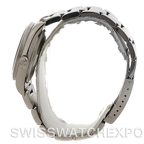 The image shows the side view of a Rolex Air-King 14010 Men's Stainless Steel White Dial 14010 Men's Stainless Steel White Dial watch, highlighting its case, crown, and stainless steel bracelet.