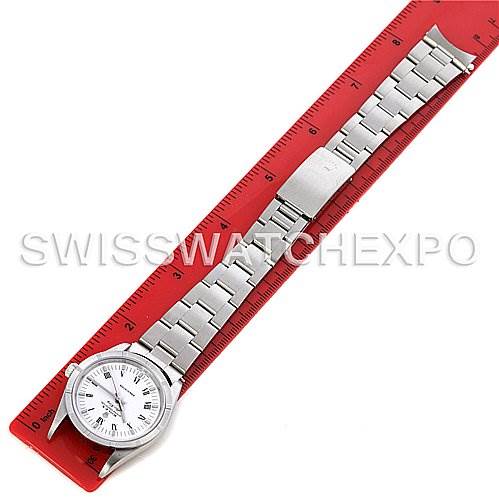 The image shows a Rolex Air-King 14010 Men's Stainless Steel White Dial 14010 Men's Stainless Steel White Dial watch laid flat with its bracelet extended along a red ruler.