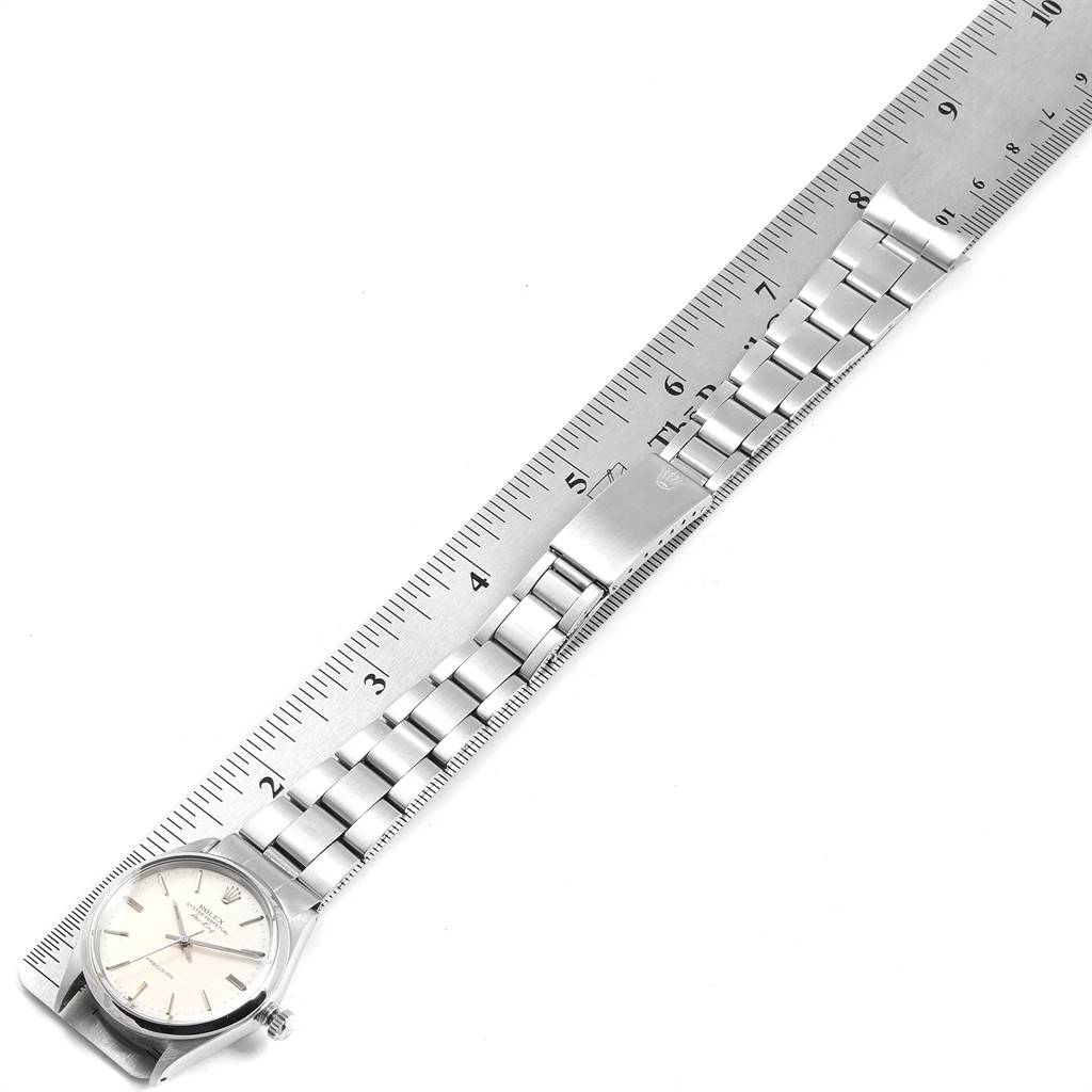 The image shows a Rolex Air-King 5500 Men's Stainless Steel Silver Dial 5500 Men's Stainless Steel Silver Dial watch laid flat, displaying the watch face and metal bracelet aligned with a ruler.