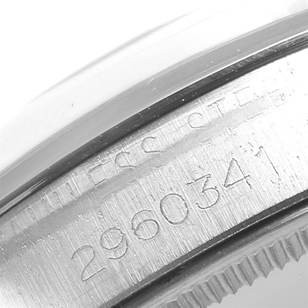 The image shows a close-up angle of the serial number engraved on the bezel of a Rolex Air-King 5500 Men's Stainless Steel Silver Dial 5500 Men's Stainless Steel Silver Dial watch.