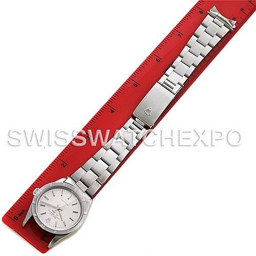 The image shows a Rolex Air-King 14010 Men's Stainless Steel Silver Dial 14010 Men's Stainless Steel Silver Dial watch laid flat against a red ruler, displaying the full length of the watch band and face.