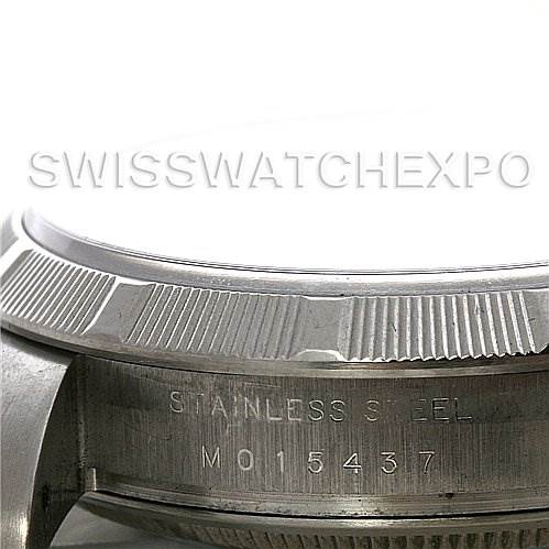 This close-up image shows the side view of a Rolex Air-King 114210 Men's Stainless Steel White Dial 114210 Men's Stainless Steel White Dial watch, focusing on the stainless steel casing and engraved serial number.