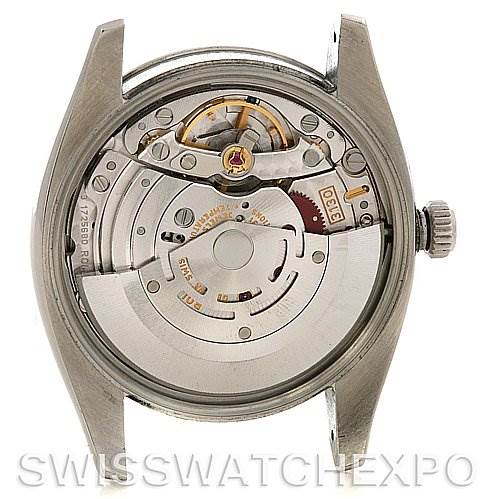 This image shows the back view of the Rolex Air-King 114210 Men's Stainless Steel White Dial 114210 Men's Stainless Steel White Dial watch, highlighting its internal mechanical movement.