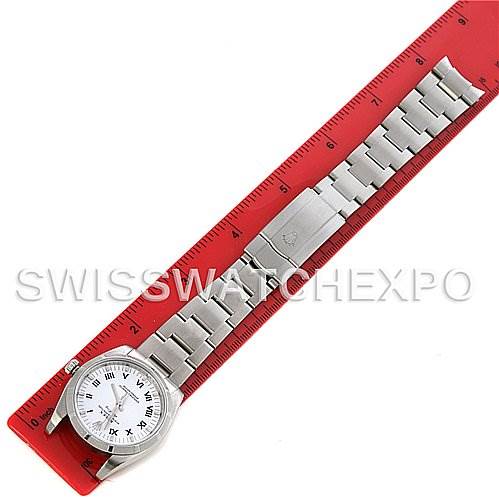 The image shows a top view of a Rolex Air-King 114210 Men's Stainless Steel White Dial 114210 Men's Stainless Steel White Dial watch, with the watch and bracelet laid flat against a red ruler.