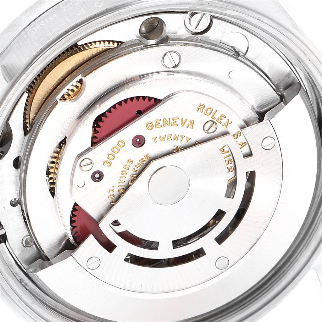 The image shows a close-up of the internal mechanism of a Rolex Air-King 14010 Men's Stainless Steel Blue Dial 14010 Men's Stainless Steel Blue Dial watch, highlighting the intricate gears and components.