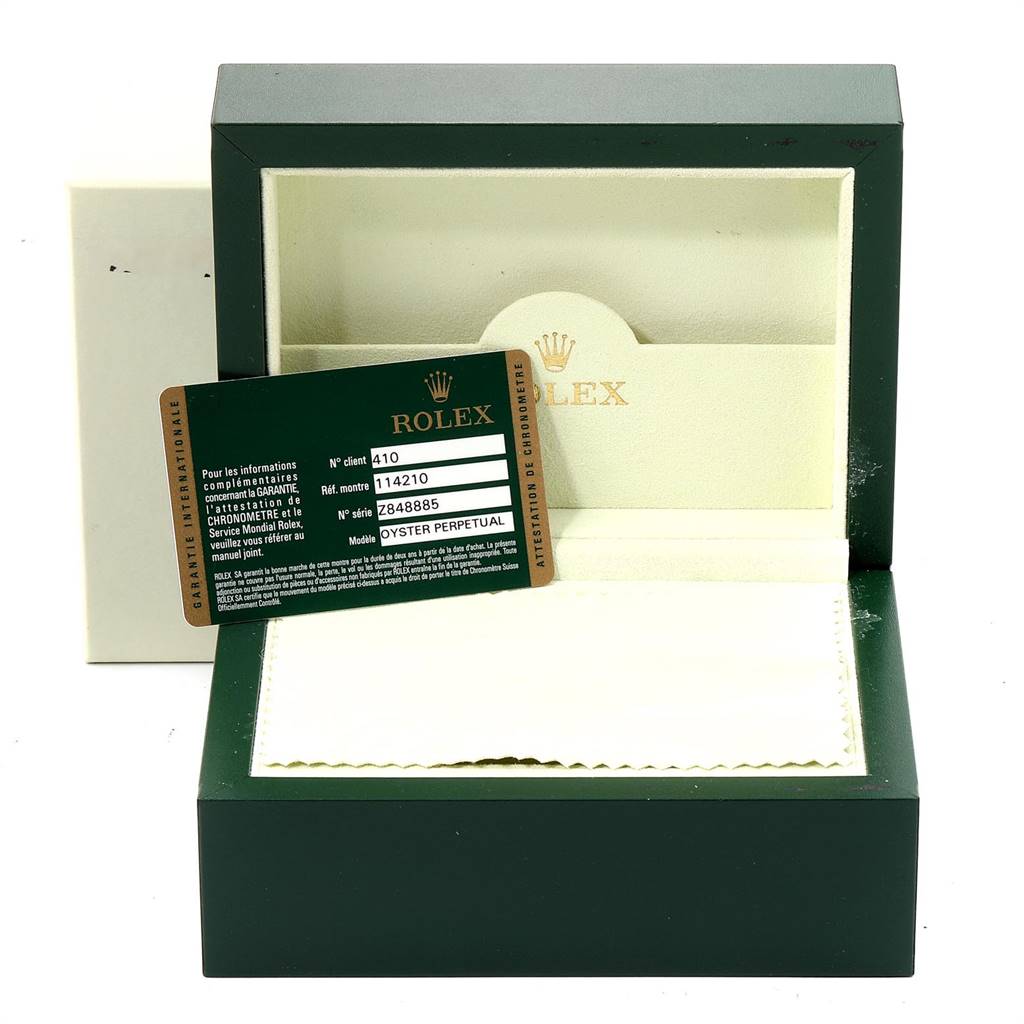The image shows the packaging box and authenticity card for the Rolex Air-King 114210 Men's Stainless Steel Grey Dial 114210 Men's Stainless Steel Grey Dial watch, with the card inside the box.