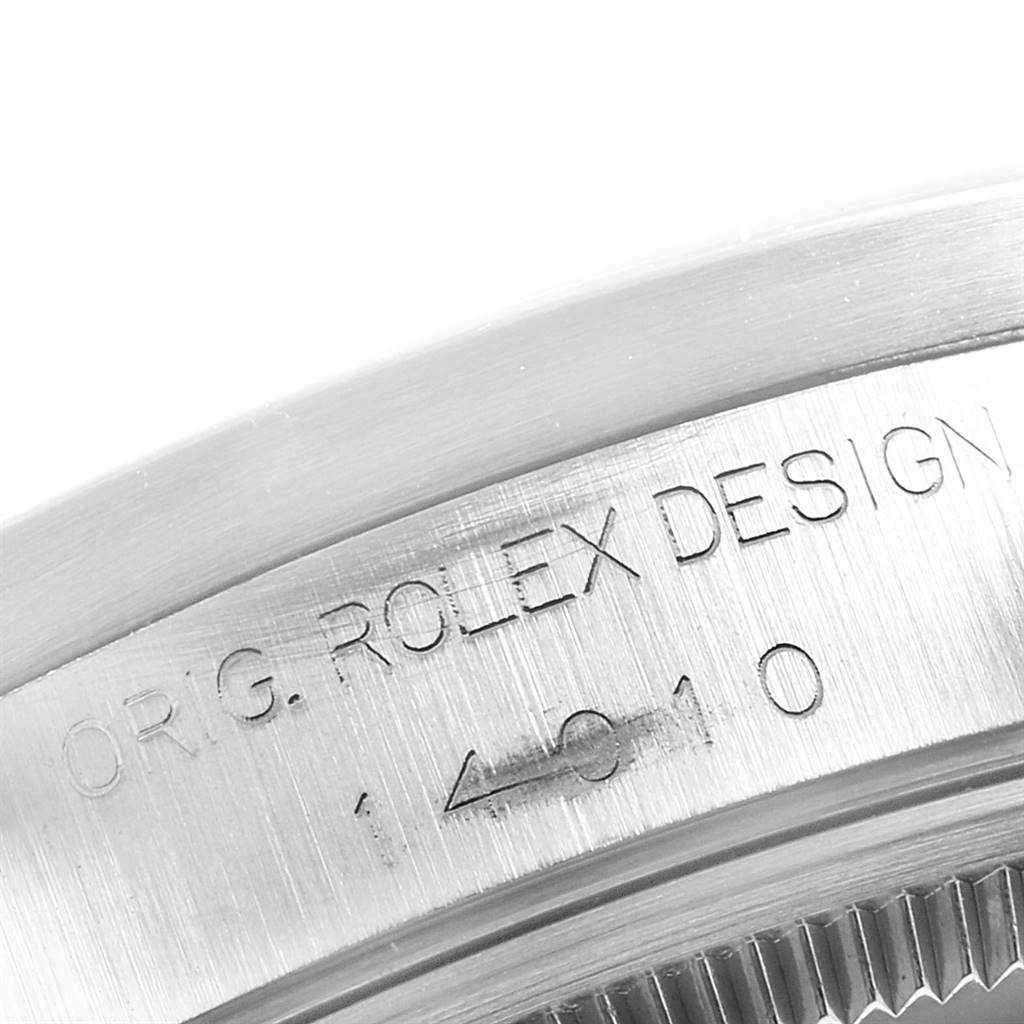 This close-up image shows the side engraving on the bezel of a Rolex Air-King 14010 Men's Stainless Steel Silver Dial 14010 Men's Stainless Steel Silver Dial watch.