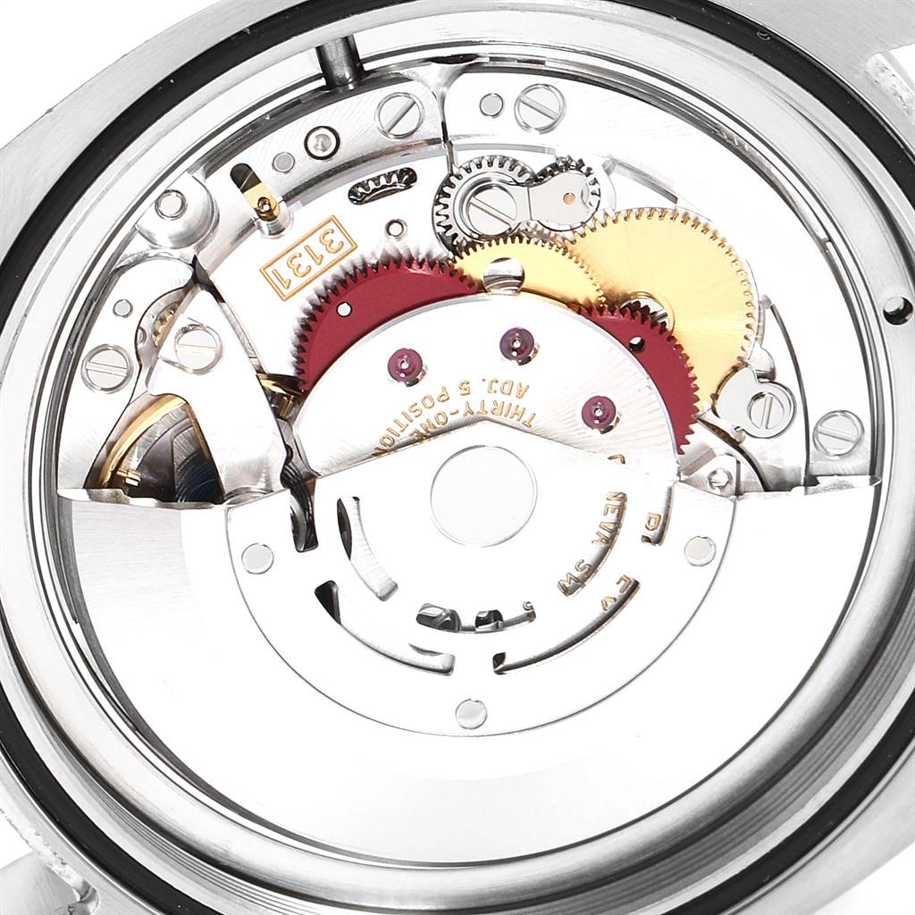 This image shows the intricate internal mechanism of a Rolex Air-King 116900 Men's Stainless Steel Black Dial 116900 Men's Stainless Steel Black Dial watch from a back angle, highlighting gears and components.