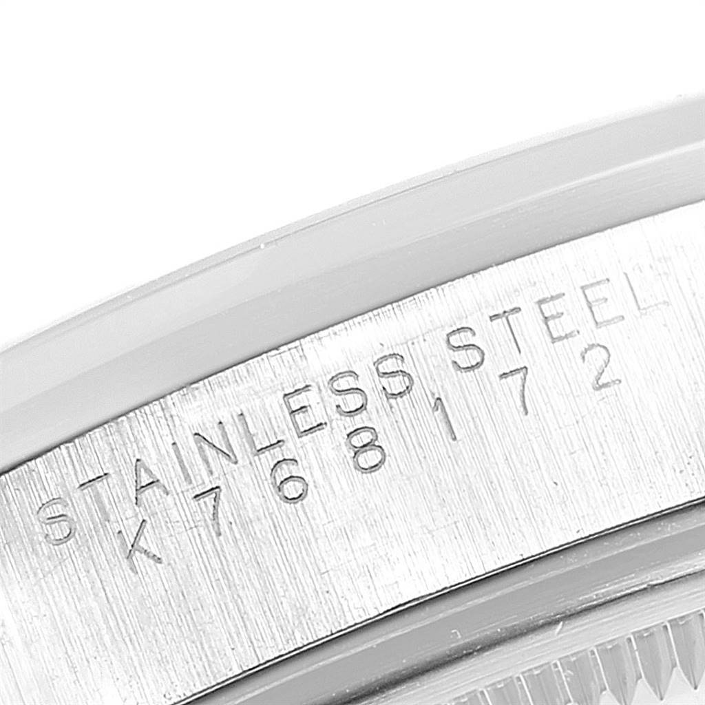 The image shows a close-up angle of the stainless steel text and engraved serial number on a Rolex Air-King 14000 Men's Stainless Steel Blue Dial 14000 Men's Stainless Steel Blue Dial watch.