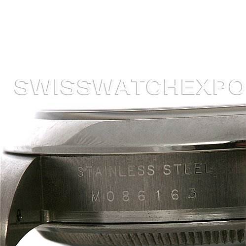 The image shows a close-up of the case side of a Rolex Air-King 114200 Men's Stainless Steel Silver Dial 114200 Men's Stainless Steel Silver Dial watch, highlighting the stainless steel material and serial number.