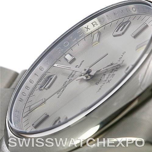 The image shows a close-up angled view of the Rolex Air-King 114200 Men's Stainless Steel Silver Dial 114200 Men's Stainless Steel Silver Dial watch, highlighting the bezel, dial, and hour markers.
