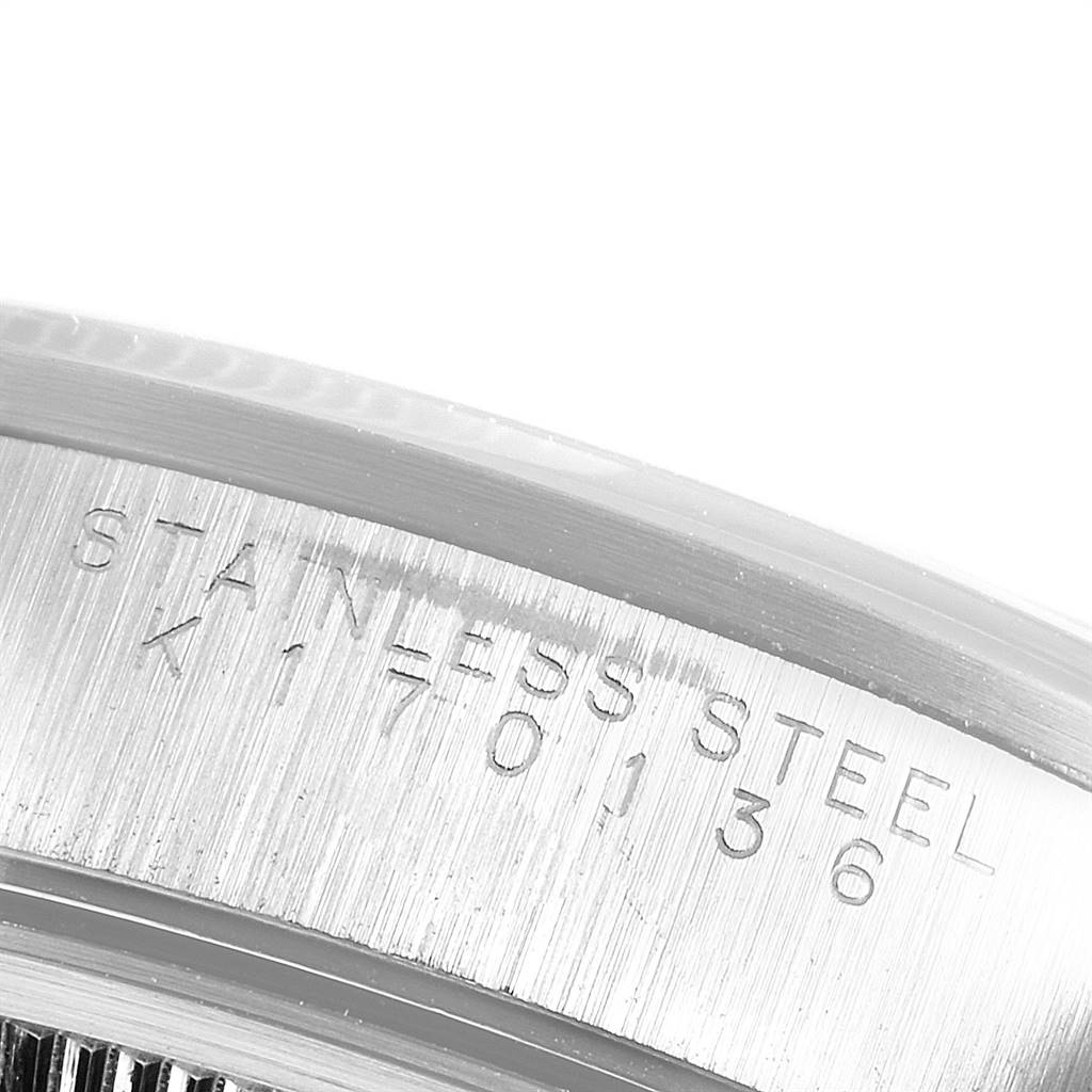 This image shows a close-up view of the serial number engraving on the stainless steel case of the Rolex Air-King 14000 Men's Stainless Steel Black Dial 14000 Men's Stainless Steel Black Dial watch.