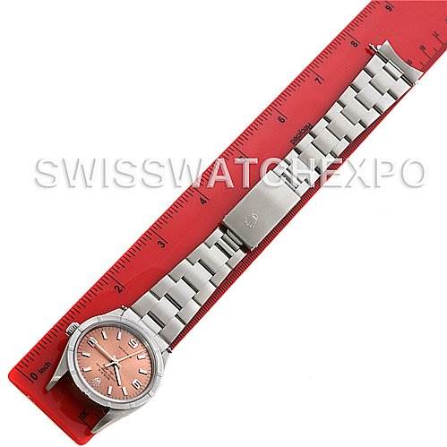 The image shows a Rolex Air-King 14010 Men's Stainless Steel Pink Dial 14010 Men's Stainless Steel Pink Dial watch laid flat next to a red ruler, highlighting the face, band, and clasp.
