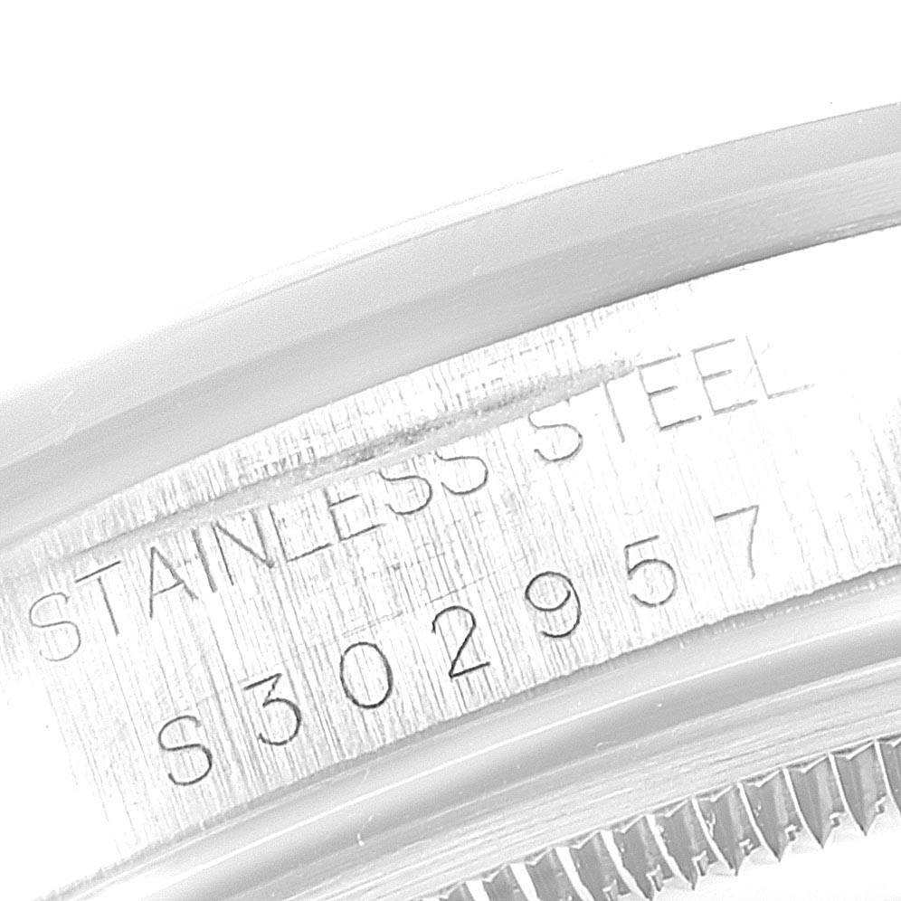 This image shows a close-up view of the serial number and "STAINLESS STEEL" engraving on the Rolex Air-King 14000 Men's Stainless Steel Silver Dial 14000 Men's Stainless Steel Silver Dial model watch.